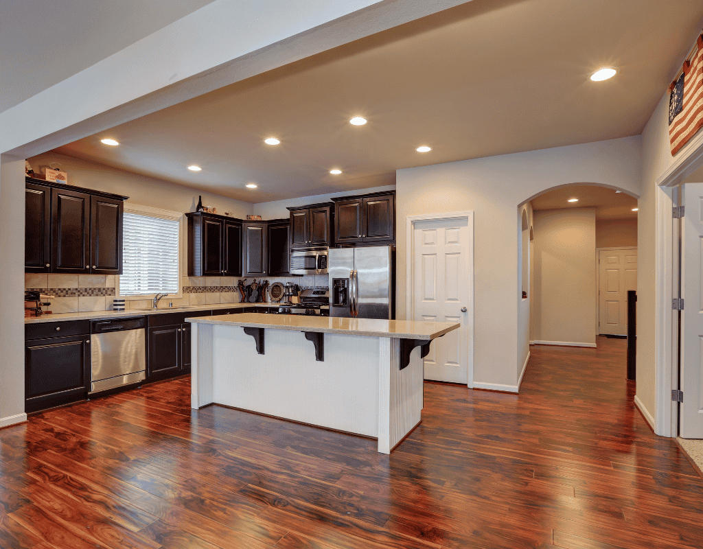 Spacious kitchen addition in Rexburg, Idaho featuring hardwood floors and center island
