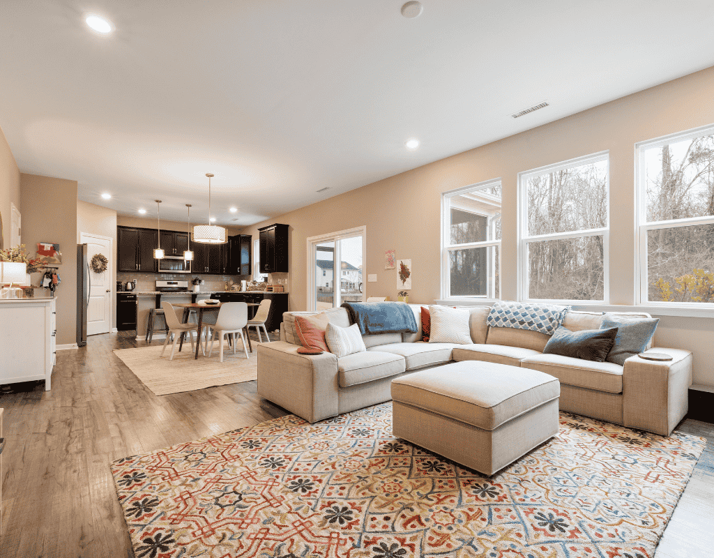 Open concept living and dining room expansion in Rexburg, ID with large windows and modern finishes