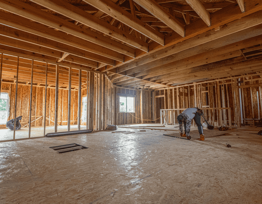 Interior framing stage of new home construction in Rexburg, ID showing open floor plan layout