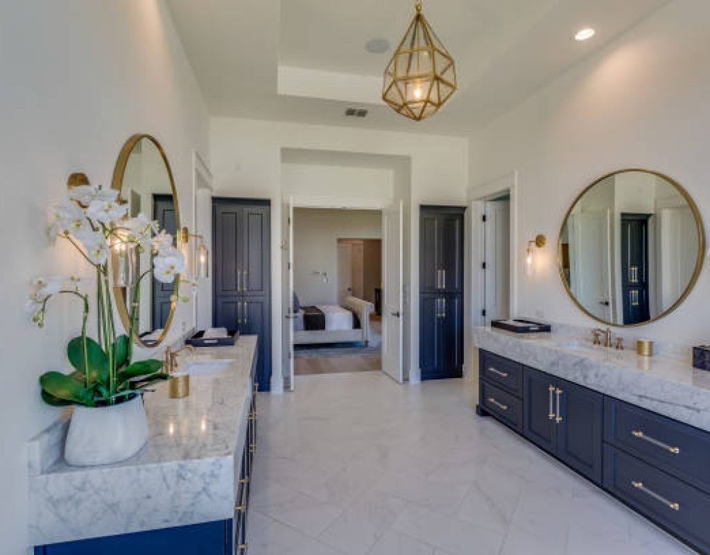 Remodeling team installing a custom walk-in shower and vanity in a St. Anthony, ID family home