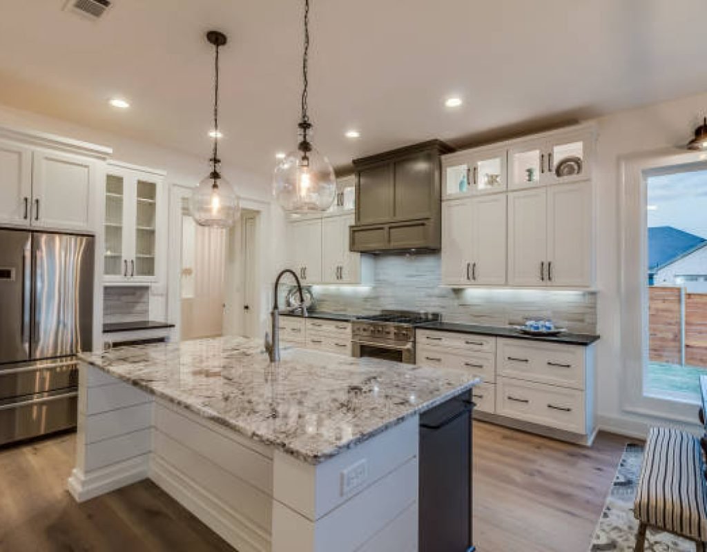 Skilled carpenter measuring countertops for a precise installation in a newly remodeled Idaho Falls kitchen