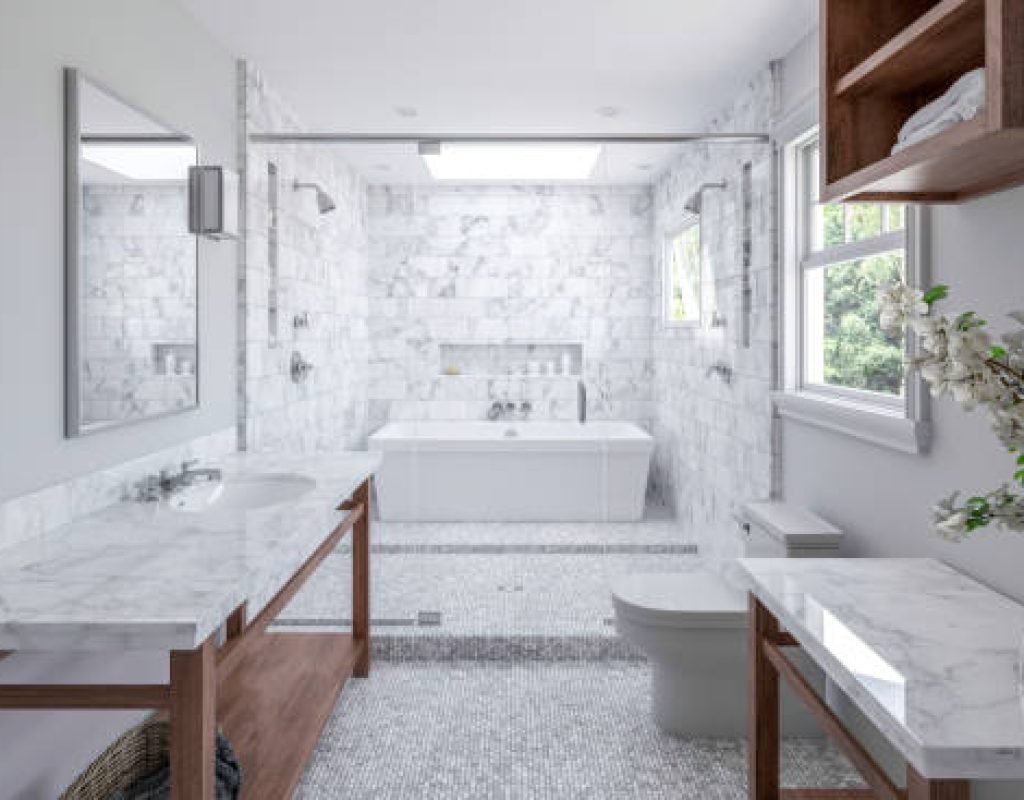 Clean and functional bathroom remodel with bright lighting and new tiles