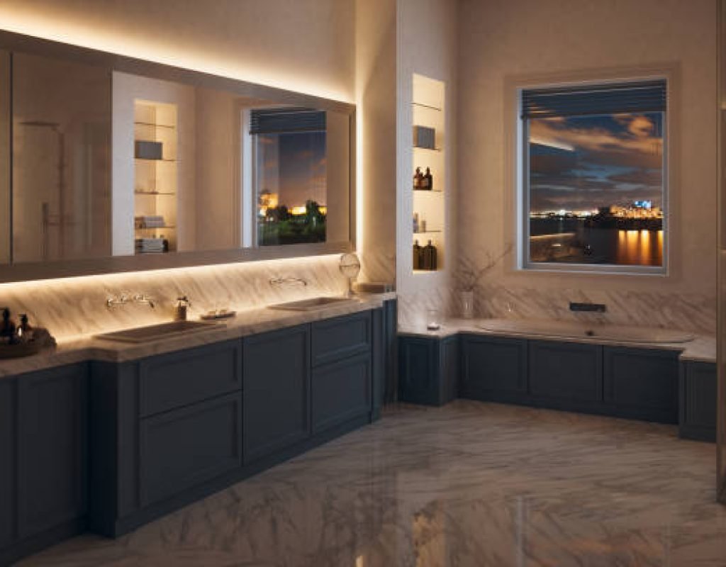 Remodeled bathroom with glass shower enclosure and stylish tile walls